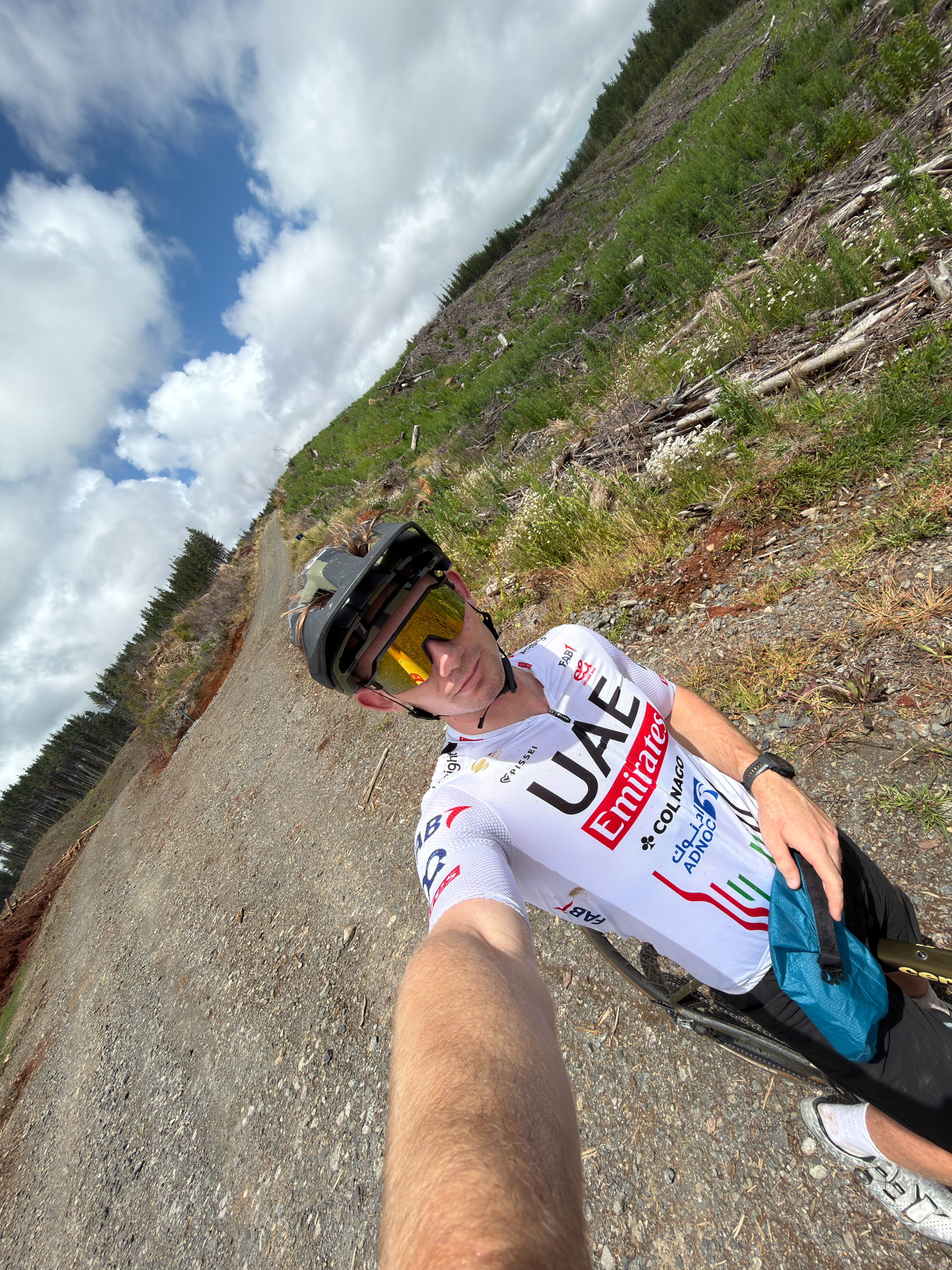 James Mowat on a gravel climb in cycling kit